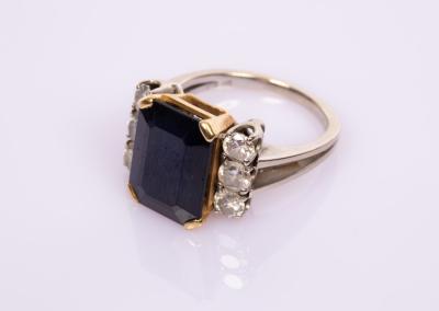 Appraisal: A sapphire and diamond dress ring the emerald cut sapphire