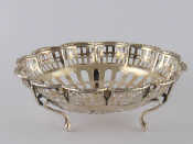 Appraisal: A pierced silver bonbon dish on three feet Birmingham cm