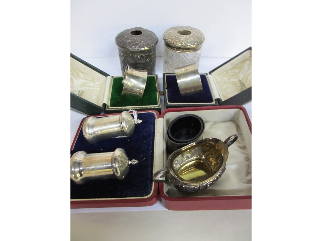 Appraisal: A lot comprising two cased silver napkin rings two hair