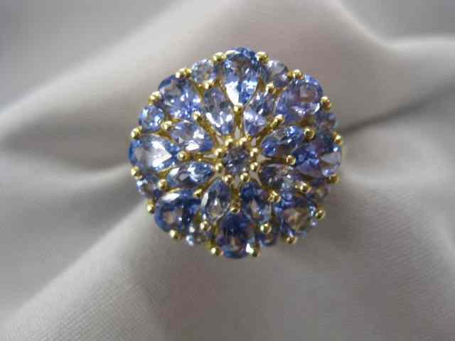 Appraisal: Tanzanite Ring rich round marquise gems totaling over carats in