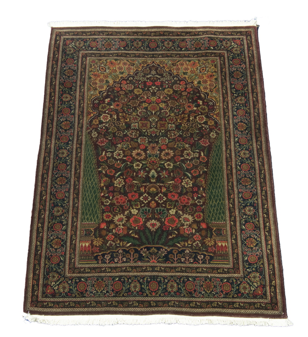 Appraisal: INDO-KASHAN PRAYER RUG The maroon ground prayer mihrab covered with