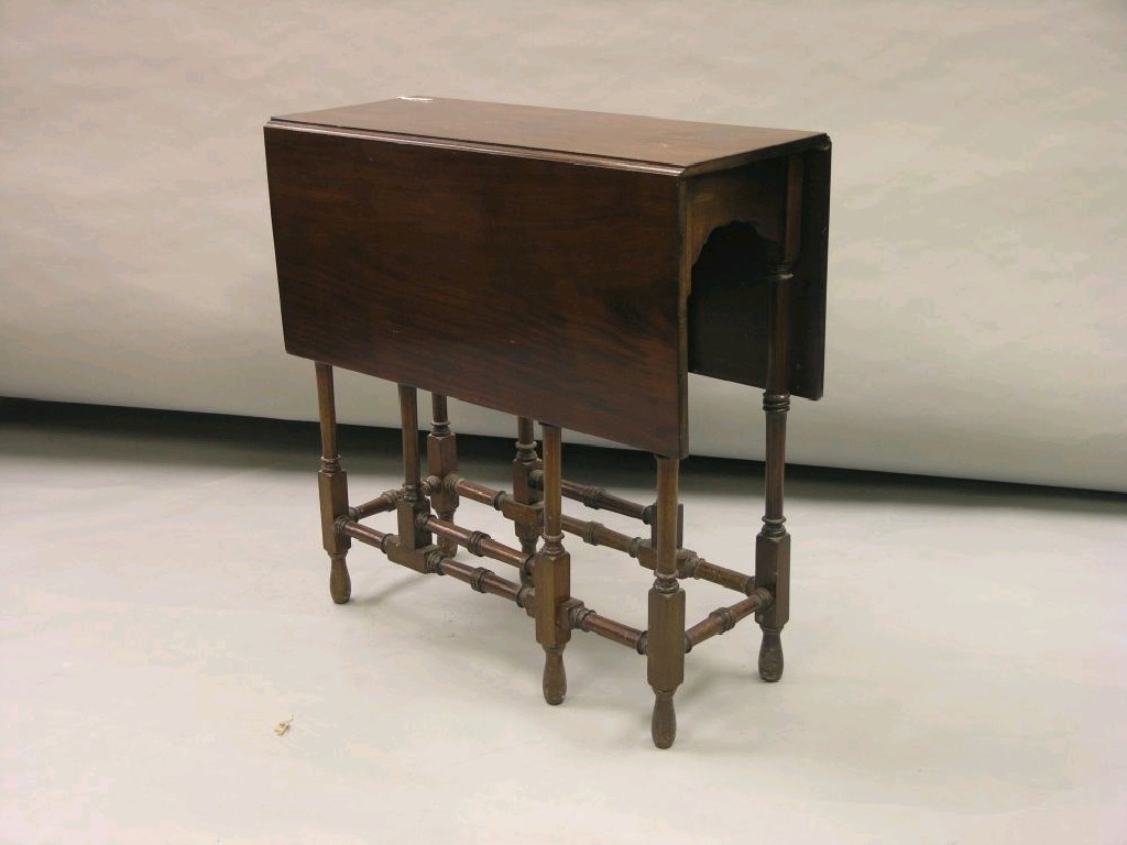 Appraisal: A late Victorian mahogany 'spider-leg' drop leaf table on slim