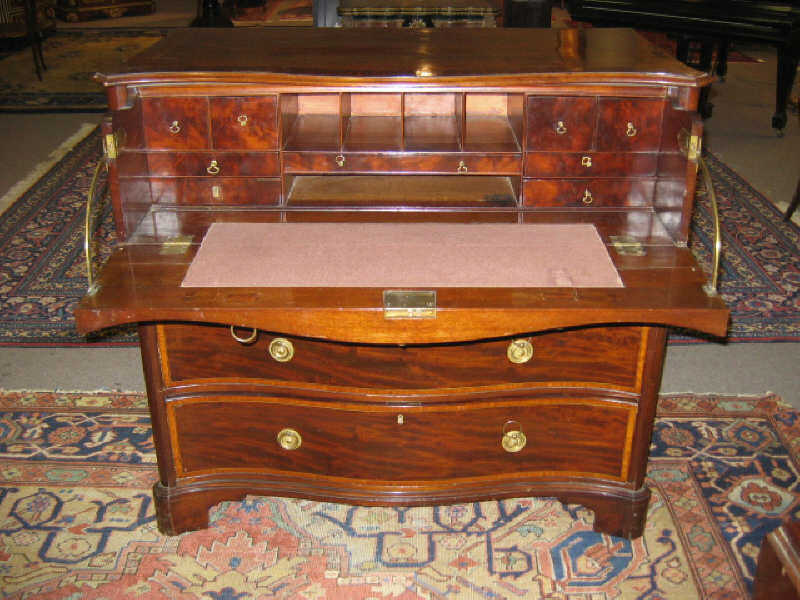 Appraisal: GEORGE III STYLE SECRETARY CHEST Of serpentine form having a