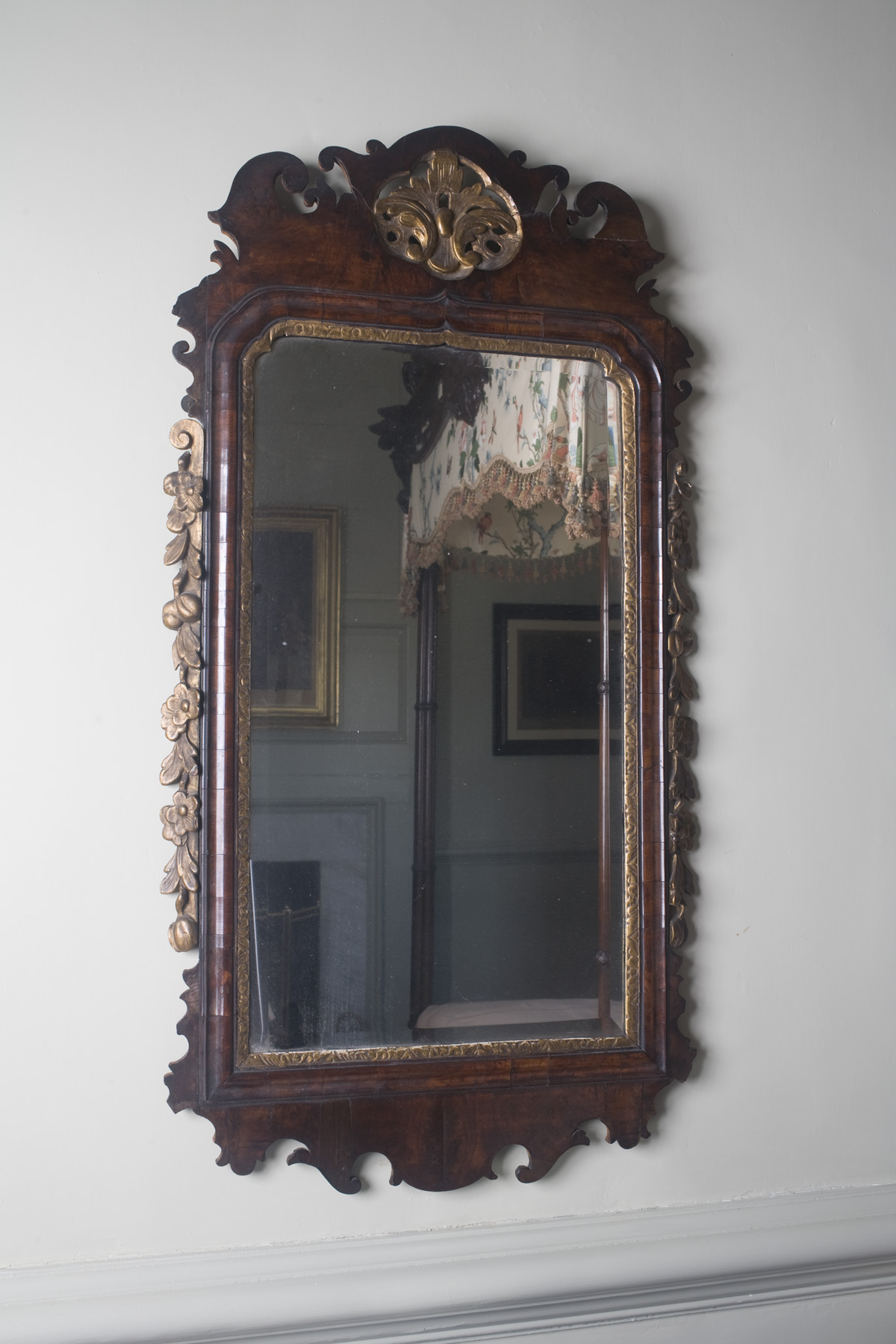 Appraisal: ENGLISH QUEEN ANNE WALNUT AND PARCEL-GILT WALL MIRROR The shaped