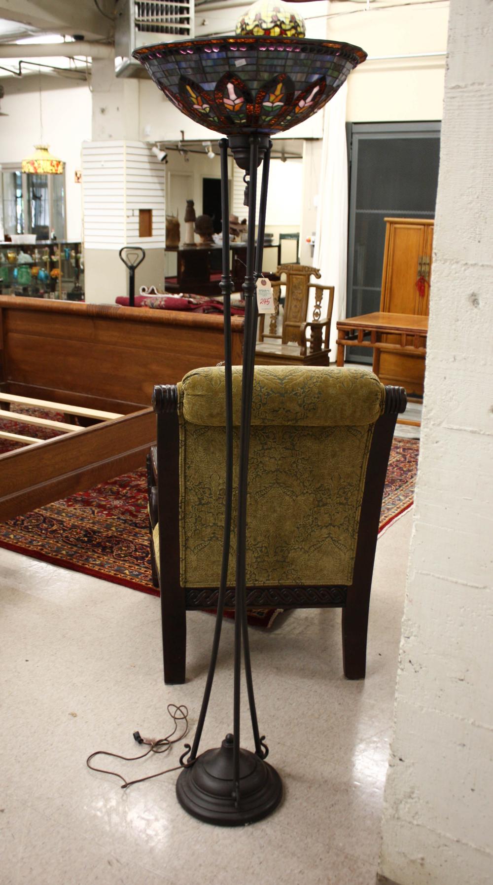 Appraisal: STAINED GLASS AND BRONZED METAL TORCHIERE FLOOR LAMP featuring a