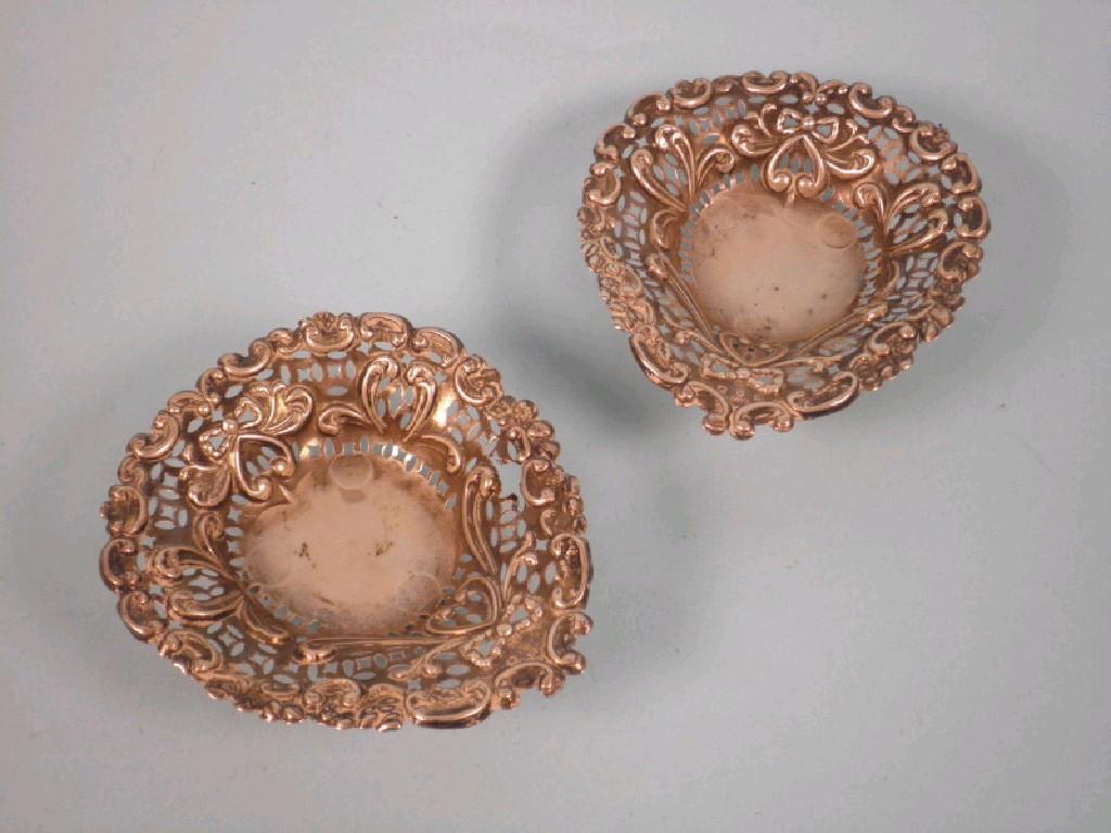 Appraisal: A pair of small embossed and pierced bon bon dishes