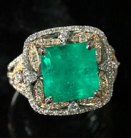 Appraisal: Lady's Fourteen-Karat Two-Color Gold Emerald and Diamond Dinner Ring composed