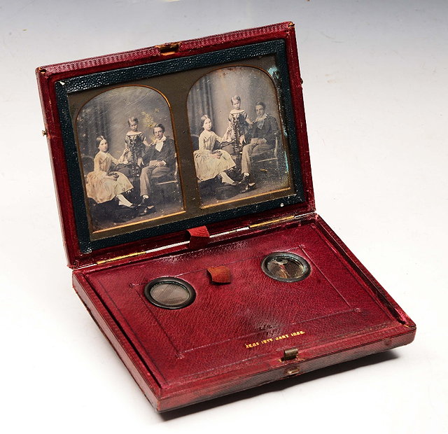 Appraisal: A MID TH CENTURY STEREOSCOPIC DAGUERREOTYPE VIEWER the burgundy leather