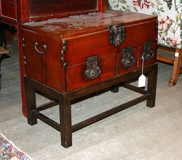 Appraisal: A Japanese small mixed wood merchant's chest on later wood