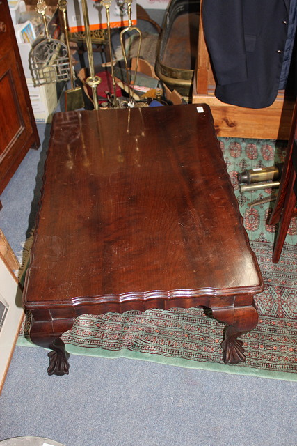 Appraisal: A SOUTH AFRICAN HARDWOOD RECTANGULAR LOW OCCASIONAL TABLE with shaped