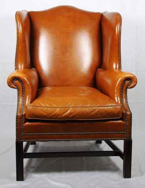 Appraisal: A wing back armchair of George III design covered in