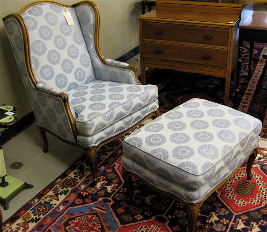 Appraisal: PAIR OF LOUIS XV STYLE WINGBACK ARMCHAIRS WITH MATCHING OTTOMAN