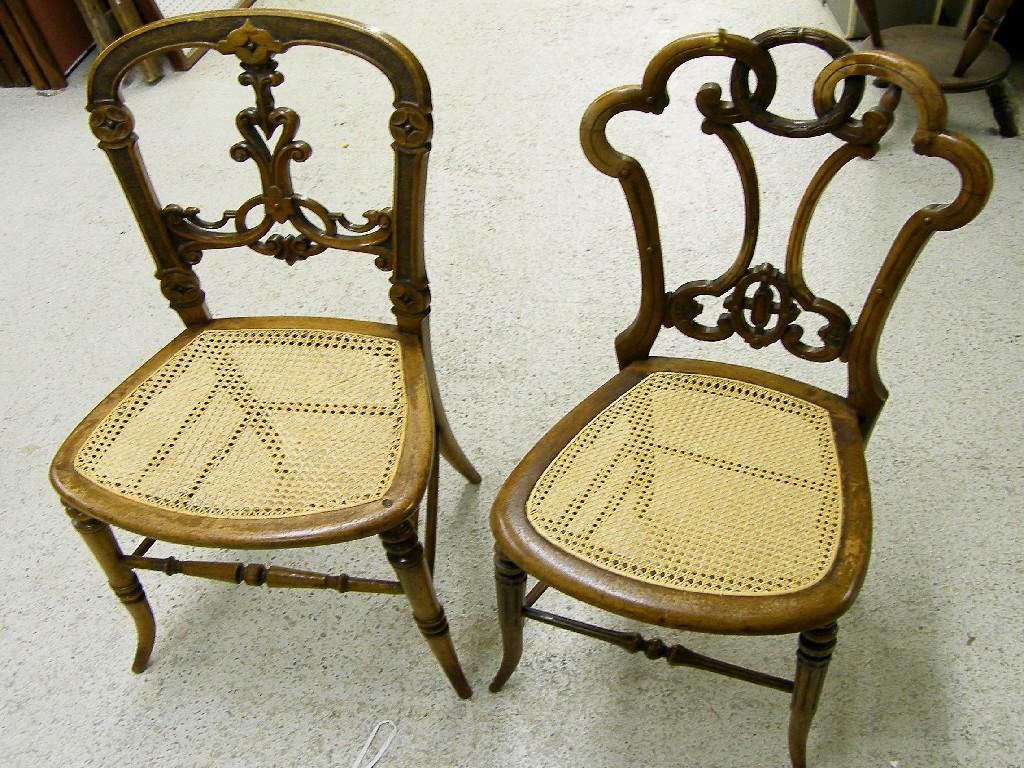 Appraisal: Two Victorian walnut bedroom chairs with ornate pierced backs over