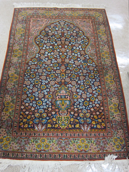 Appraisal: HAND KNOTTED ORIENTAL PRAYER RUG Pakistani-Persian featuring a dark blue