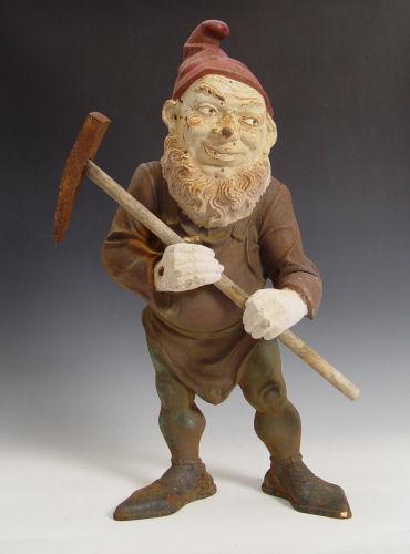 Appraisal: VINTAGE CAST IRON GARDEN GNOME Gnome holding pick ax Measures