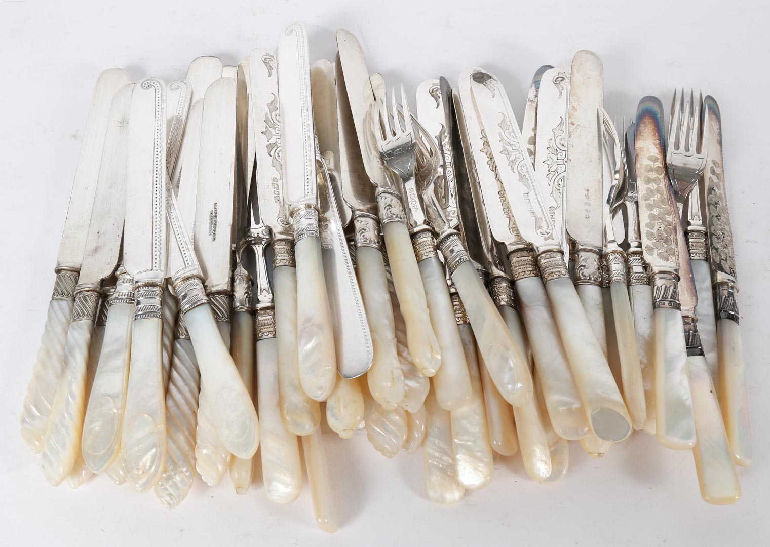 Appraisal: Mother-of-pearl handled flatware including brass carriage lamp stone bear Dresden