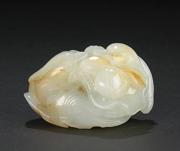 Appraisal: A white jade duck and lotus group Depicting two mandarin