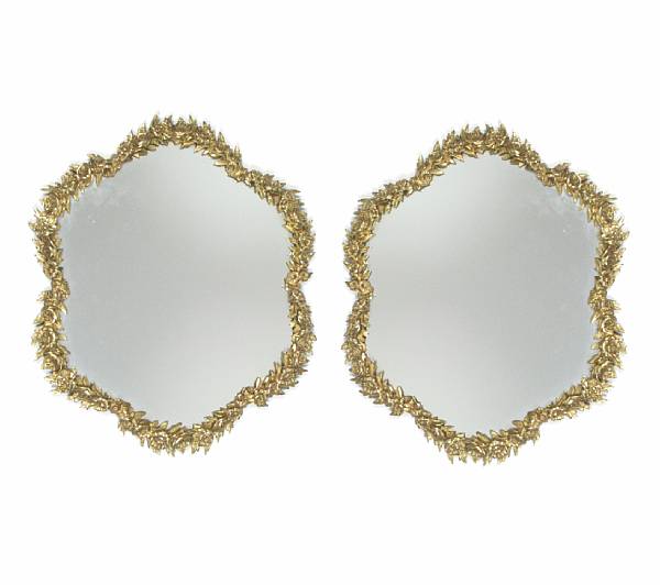 Appraisal: A pair of gilt bronze mirrors with cast floral borders