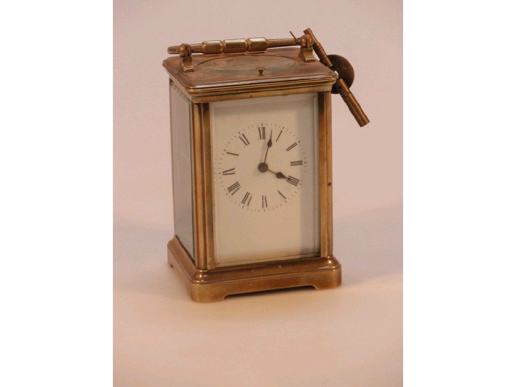 Appraisal: A gilt metal carriage clock with repeat gong strike lever