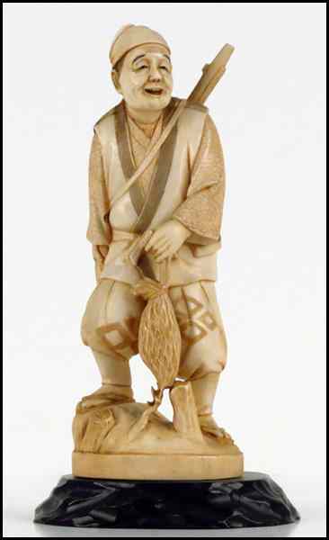 Appraisal: JAPANESE CARVED IVORY FIGURE OF A HUNTER Provenance The Collection