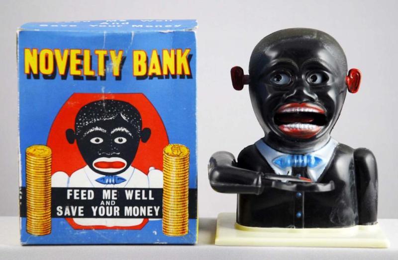 Appraisal: Plastic Jolly N Novelty Bank Toy Description Includes original key