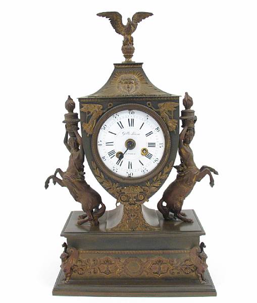 Appraisal: An Empire style patinated and gilt bronze mantel clock height