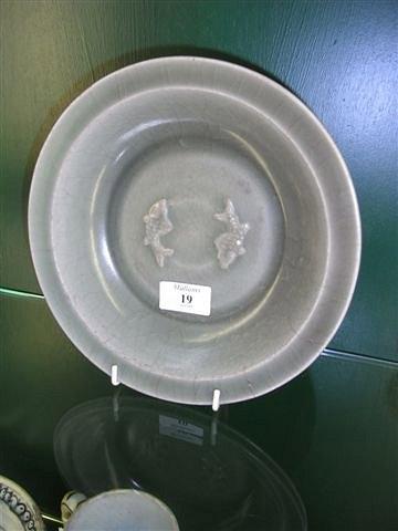 Appraisal: A CHINESE CELADON DISH with a pair of fishes in