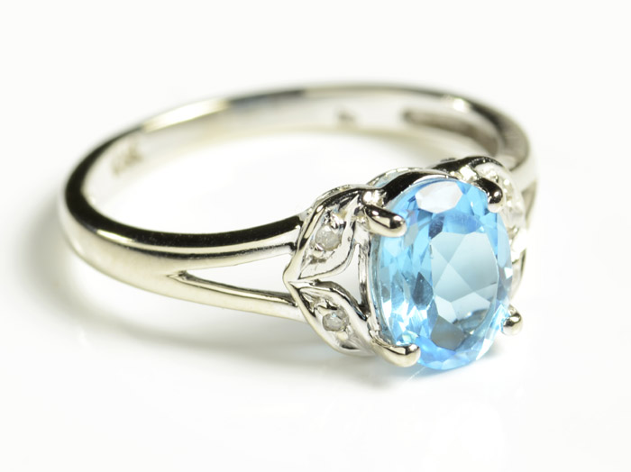 Appraisal: BLUE TOPAZ AND DIAMOND RING The k white gold ring