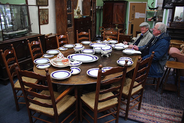 Appraisal: A LARGE REPRODUCTION OAK OVAL TOPPED DROP LEAF TABLE turned