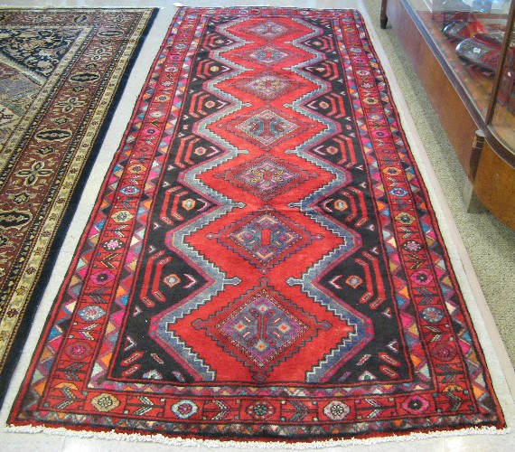 Appraisal: PERSIAN KURDISH TRIBAL HALL CARPET the design incorporating a column