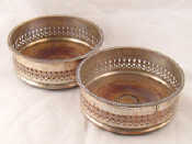 Appraisal: A pair of Old Sheffield plate decanter coasters with pierced