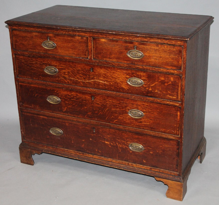 Appraisal: An thC oak chest the overhanging moulded top raised above