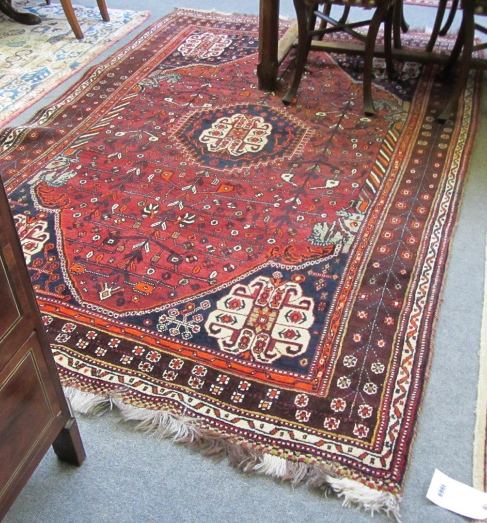 Appraisal: A Persepolis Shiraz rug South Persian the madder field with