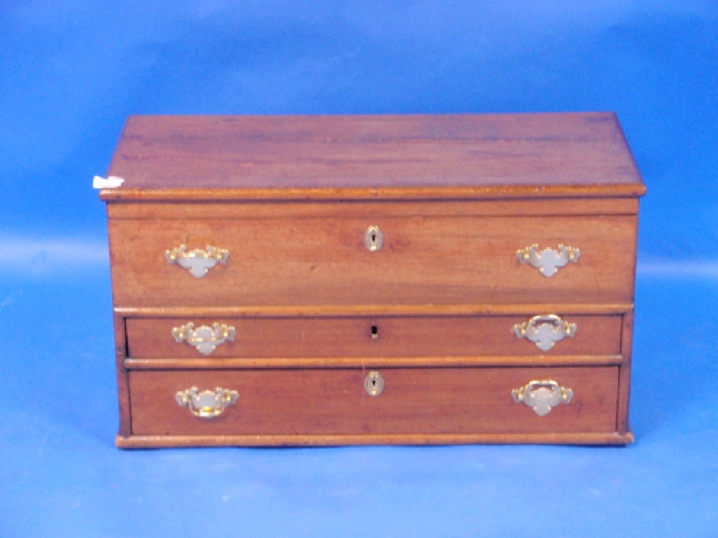 Appraisal: A Georgian mahogany chest with hinge locker top fitted with