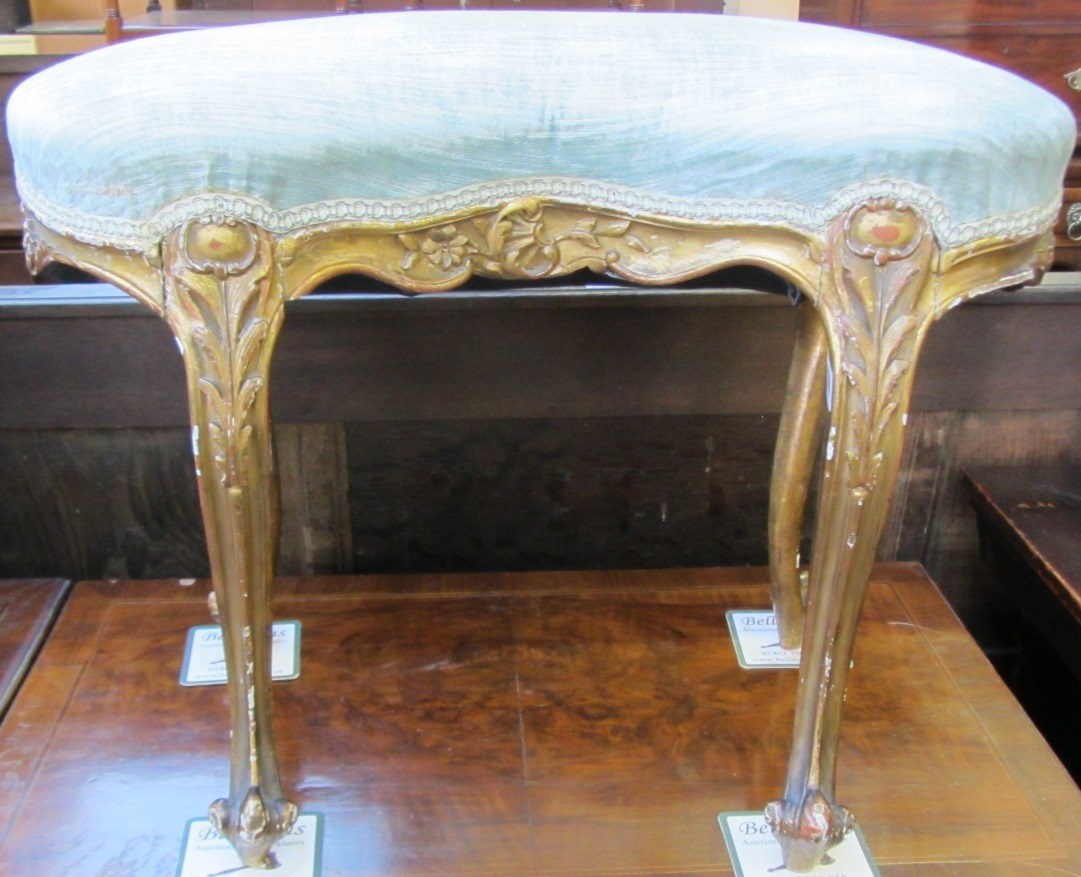 Appraisal: A late th century gilt framed kidney shaped dressing stool