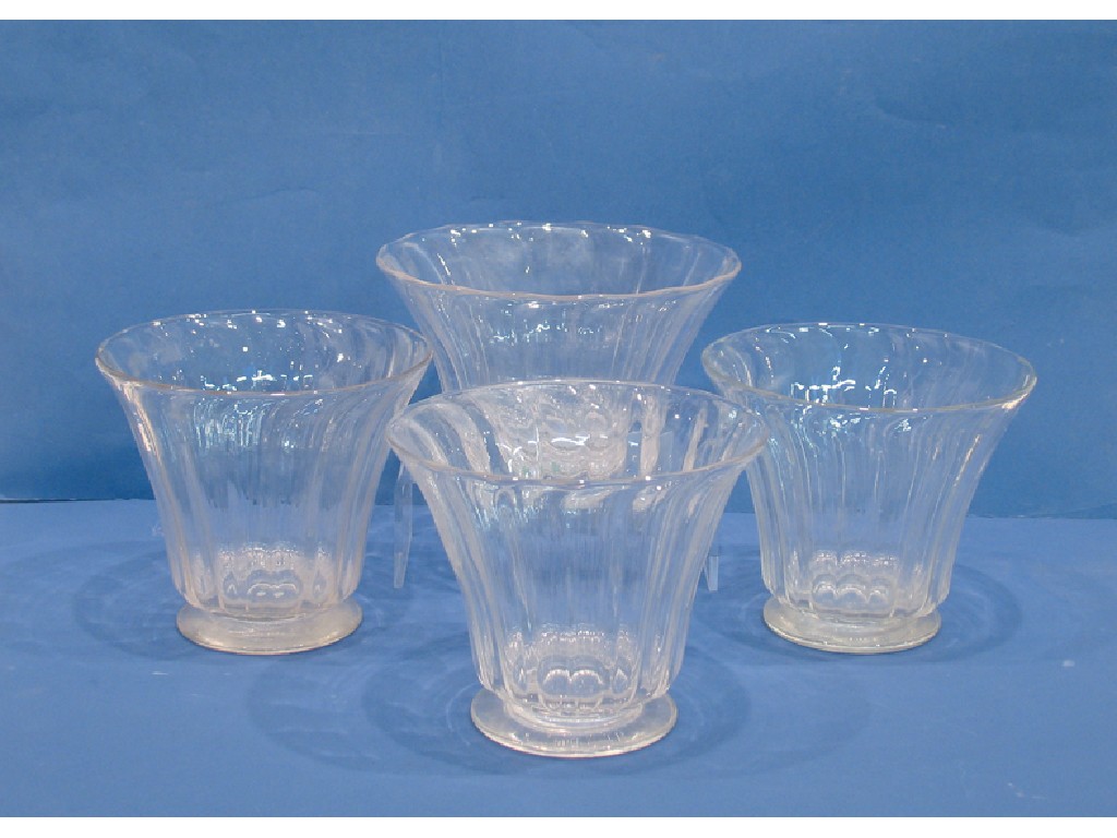 Appraisal: FOUR SIMILAR VICTORIAN CLEAR GLASS ICE BUCKETS each of flared