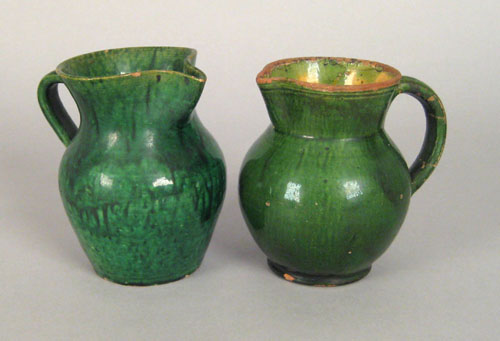 Appraisal: Two Pennsylvania green glazed redware pitchers th c one impressed