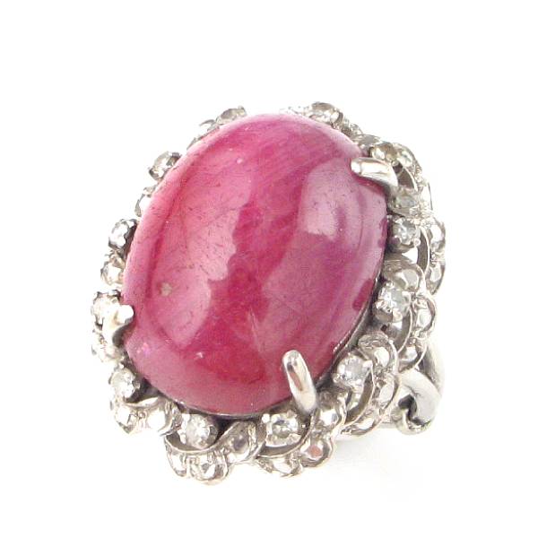 Appraisal: A ruby diamond and white gold ring oval cabochon ruby