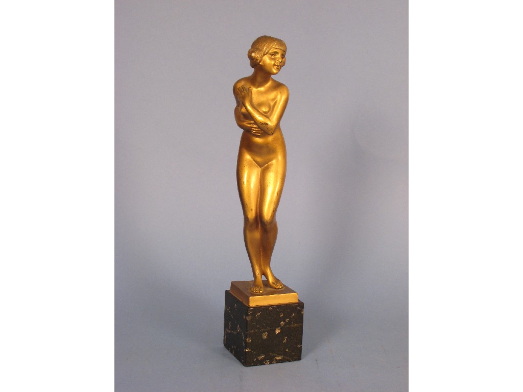 Appraisal: A bronzed Art Deco figure of a Nude on black