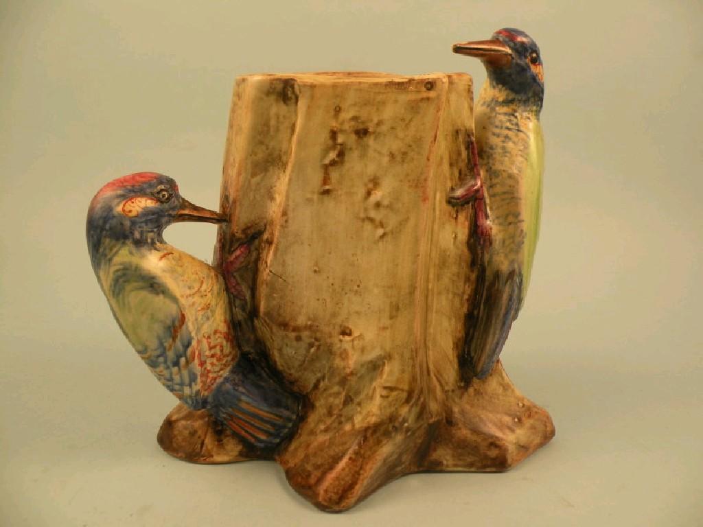 Appraisal: A pottery vase mounted with two woodpeckers inscribed to base