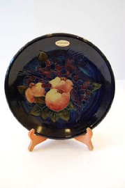 Appraisal: MOORCROFT BIRD AND FRUIT DECORATED PLATE