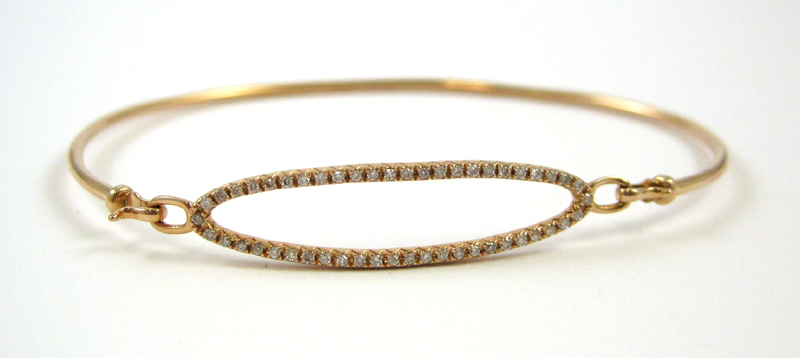 Appraisal: FOURTEEN KARAT ROSE GOLD AND DIAMOND BANGLE having fifty round-cut