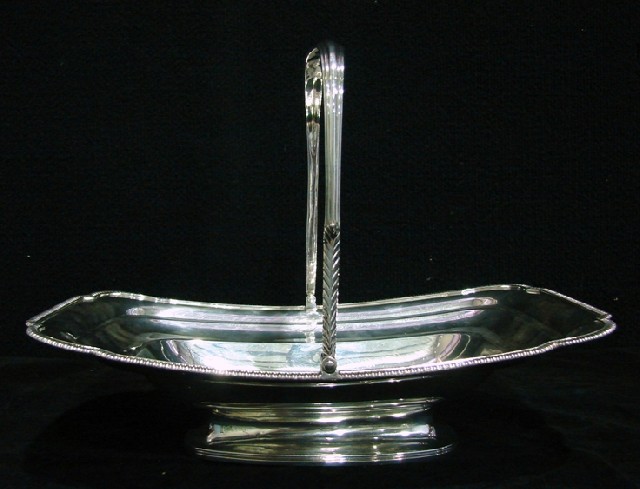 Appraisal: A Georgian sterling silver swing handle basket of stepped rectangular