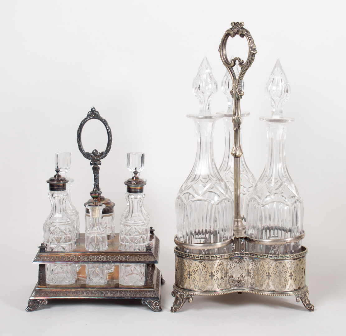 Appraisal: Two Victorian plated caster frames with bottles Condition Some smaller