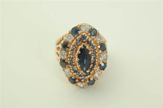 Appraisal: SAPPHIRE GOLD AND DIAMOND RING Twentieth century sapphire and diamond