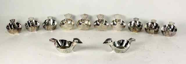 Appraisal: A collection of twelve Spanish silver plated bird shaped bowls