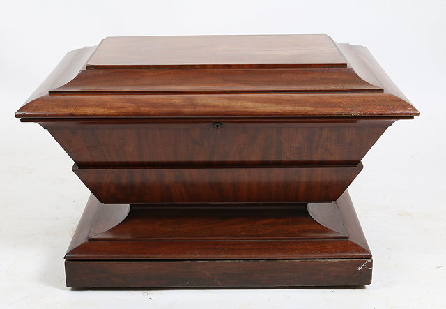 Appraisal: A GEORGIAN MAHOGANY RECTANGULAR CELLARETTE of sarcophagus form with waisted