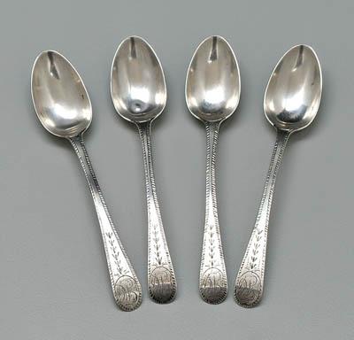 Appraisal: Four Enos Reeves coin spoons oval handles with feather edges