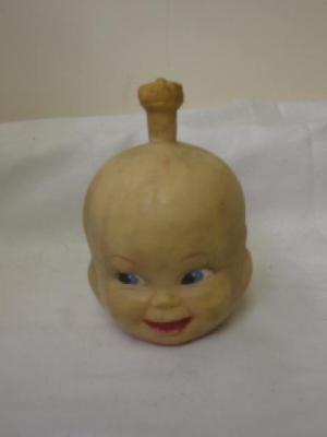 Appraisal: A rubber three faced dolls head with painted eyes and