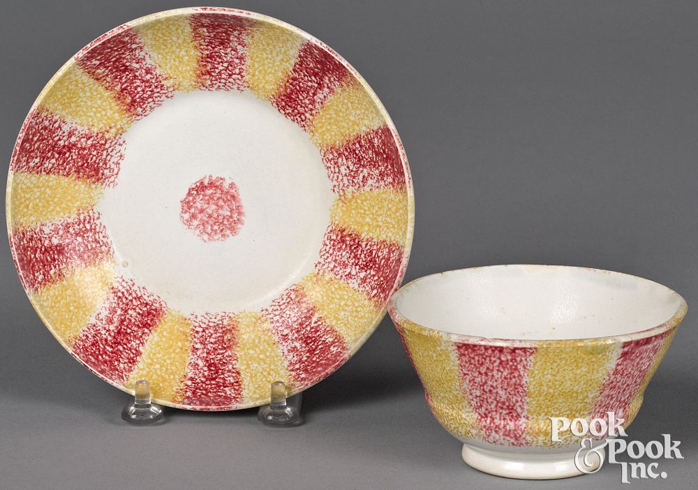 Appraisal: Red and yellow rainbow spatter cup and saucer Red and